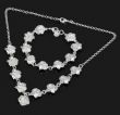 Серебряные ожерелье и браслет с девятью розами